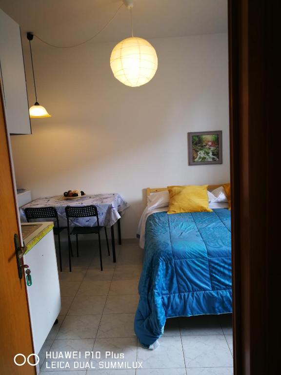 Posteľ alebo postele v izbe v ubytovaní Villa Galilei Rooms