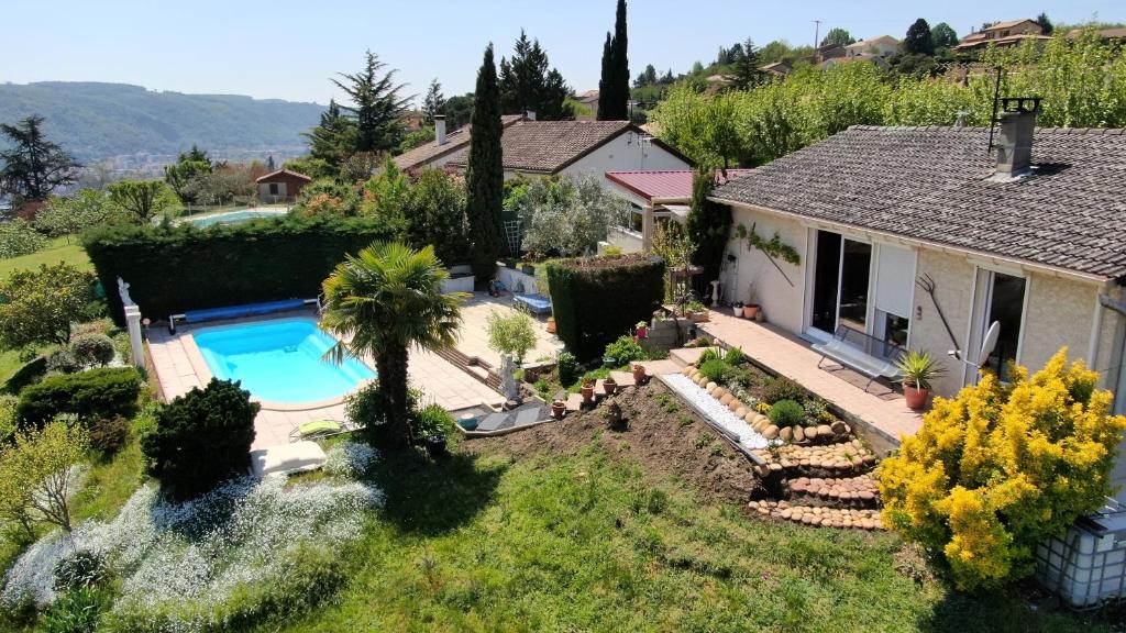 a house with a swimming pool in a yard at La Colombe in Vienne