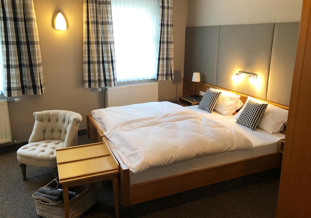 Postel nebo postele na pokoji v ubytování Mangolds Boutique Hotel & Fruehstuecksmeisterei