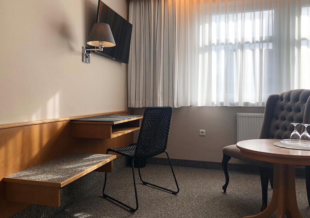 TV a/nebo společenská místnost v ubytování Mangolds Boutique Hotel & Fruehstuecksmeisterei