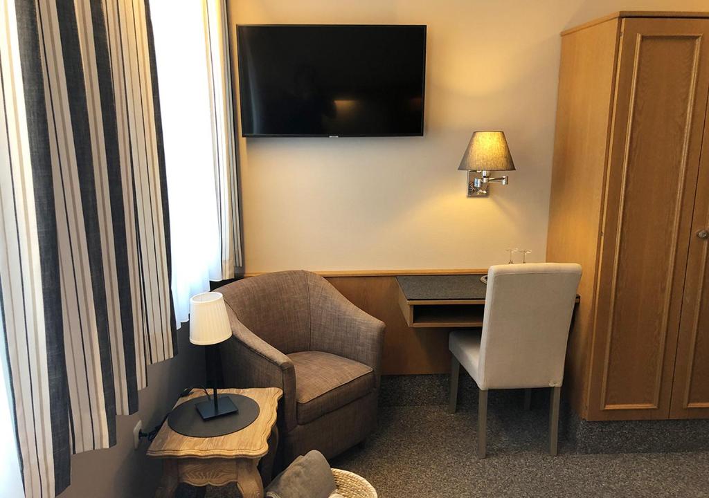 TV a/nebo společenská místnost v ubytování Mangolds Boutique Hotel & Fruehstuecksmeisterei