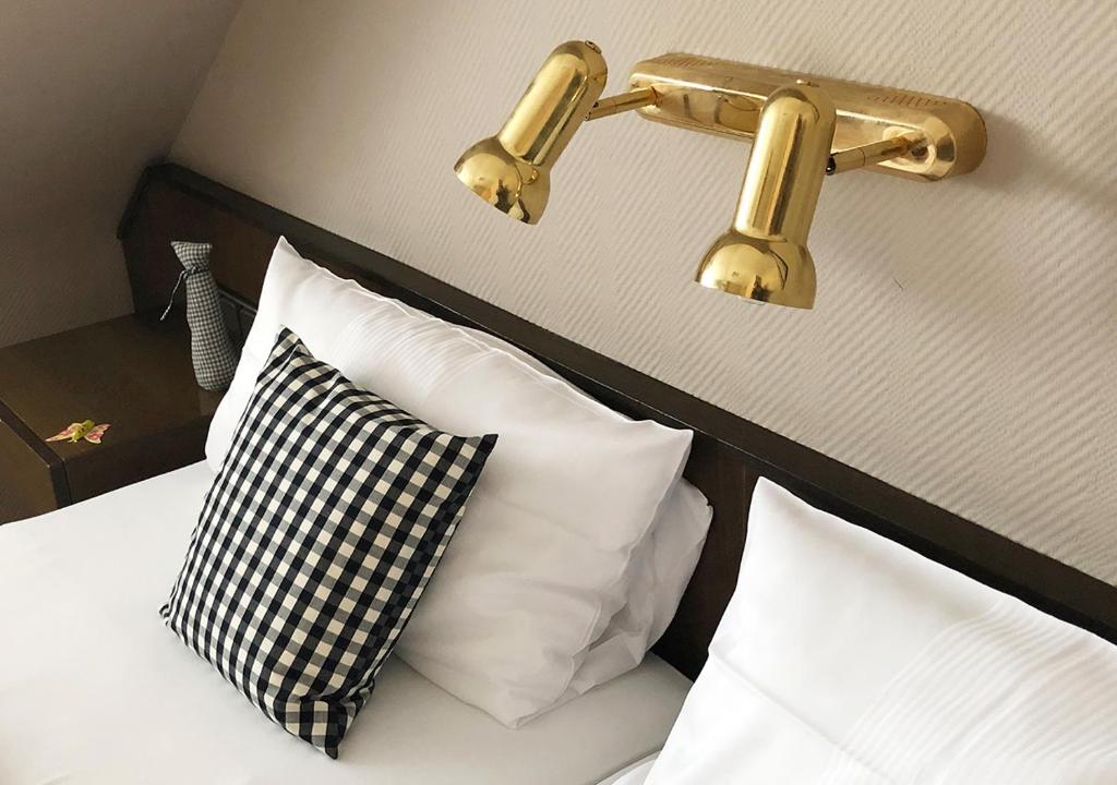 Postel nebo postele na pokoji v ubytování Mangolds Boutique Hotel & Fruehstuecksmeisterei