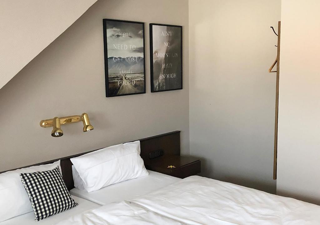 Postel nebo postele na pokoji v ubytování Mangolds Boutique Hotel & Fruehstuecksmeisterei