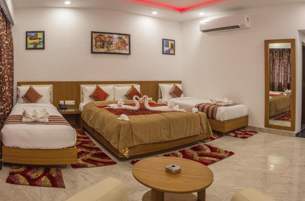 Postel nebo postele na pokoji v ubytování Hotel Suktara International