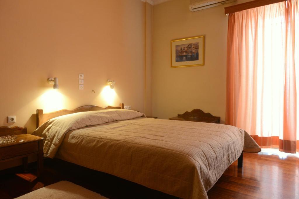 Postel nebo postele na pokoji v ubytování Melissa II Hotel