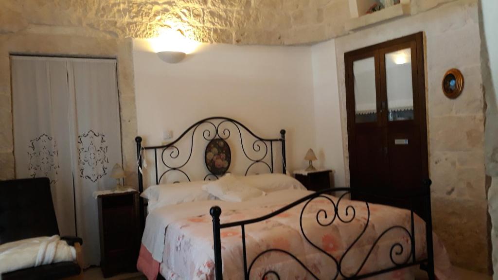Postel nebo postele na pokoji v ubytování B&B Salita Delle Pere