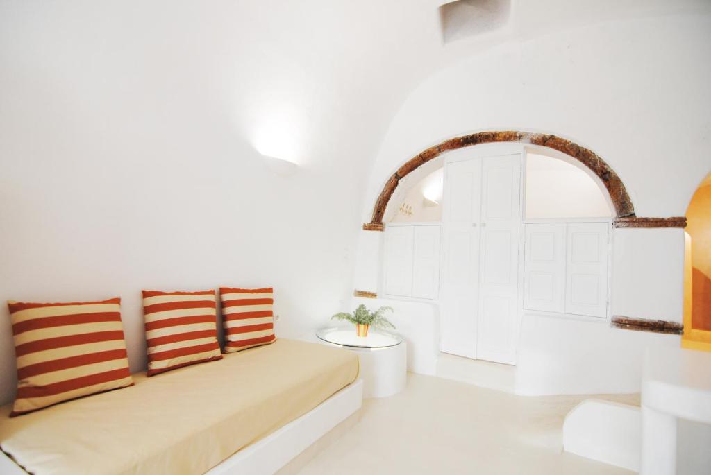 A bed or beds in a room at White Grape Suites