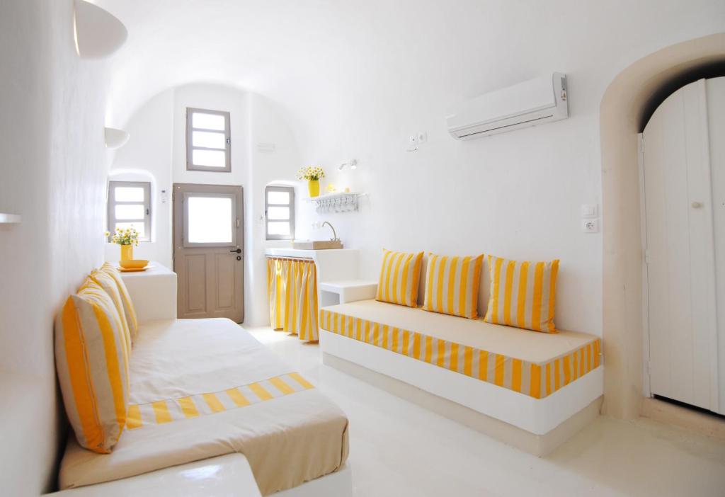 A bed or beds in a room at White Grape Suites