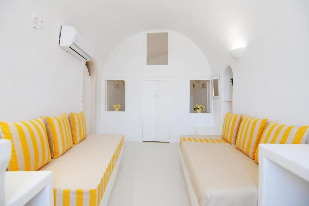 A bed or beds in a room at White Grape Suites