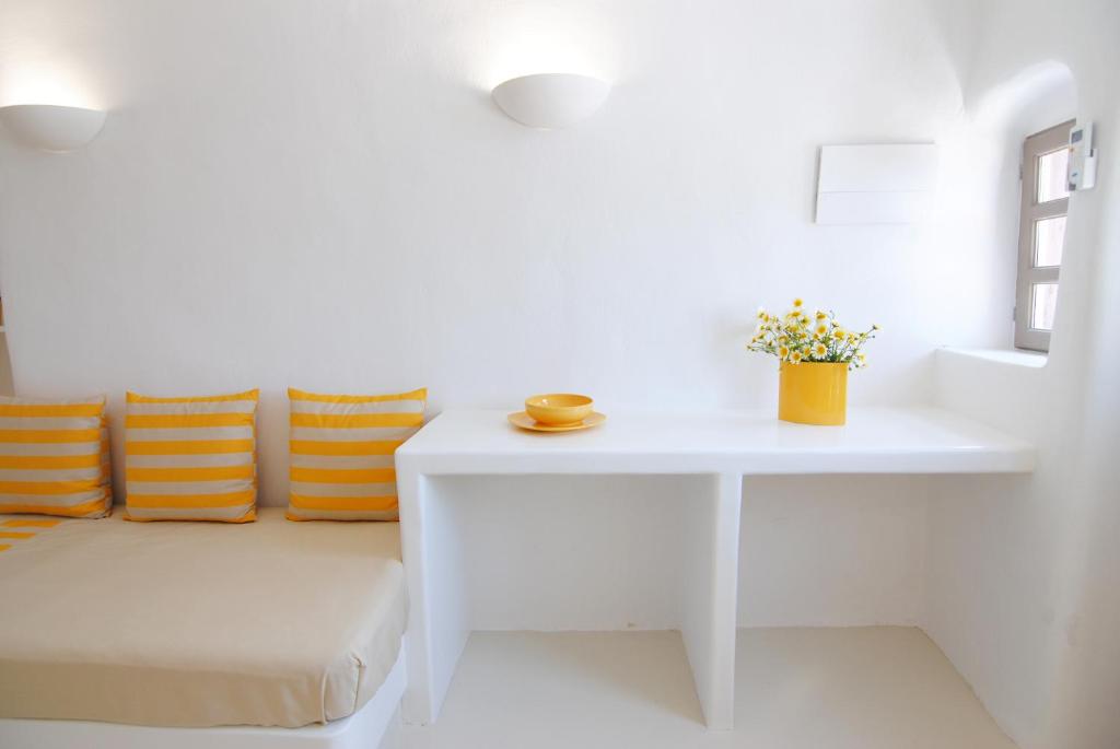 A bed or beds in a room at White Grape Suites