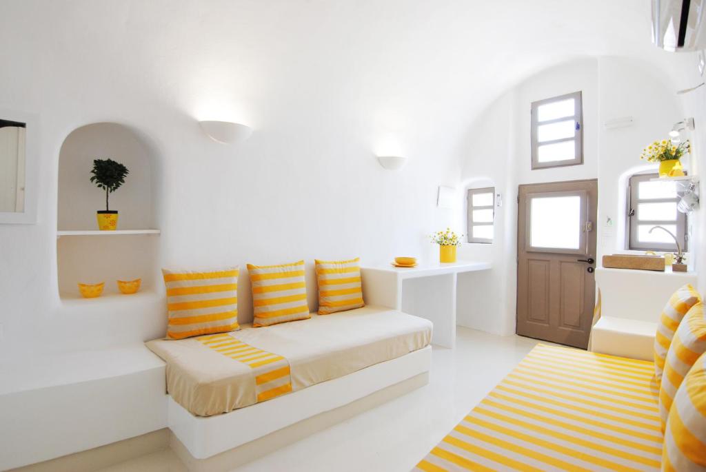 A bed or beds in a room at White Grape Suites