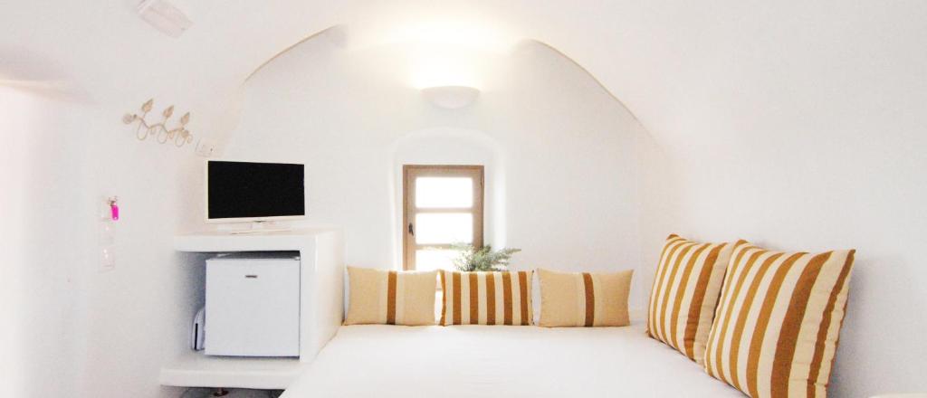 A bed or beds in a room at White Grape Suites
