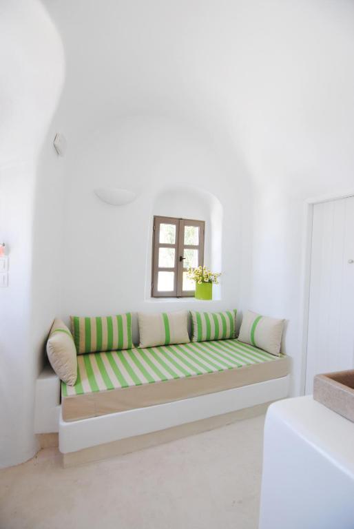 A bed or beds in a room at White Grape Suites