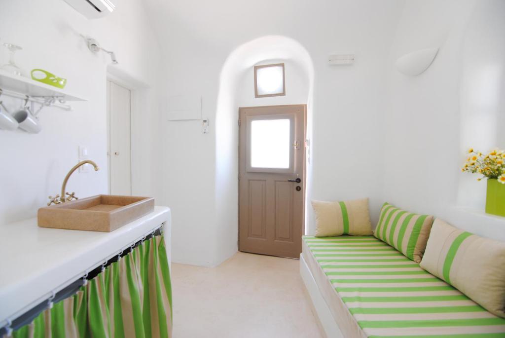 A bed or beds in a room at White Grape Suites