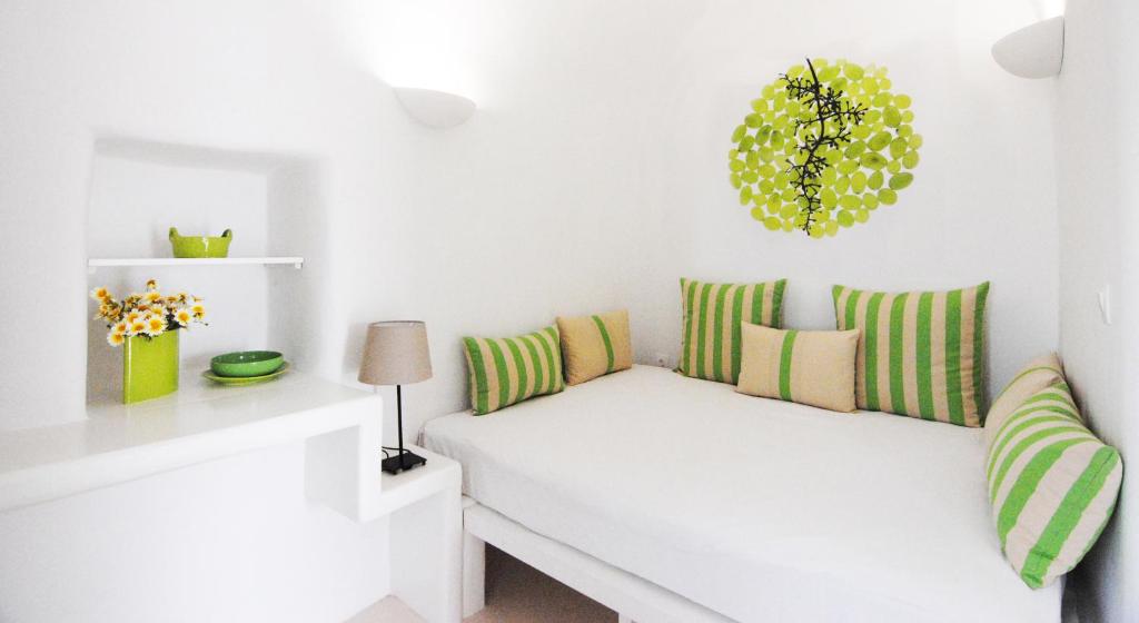 A bed or beds in a room at White Grape Suites
