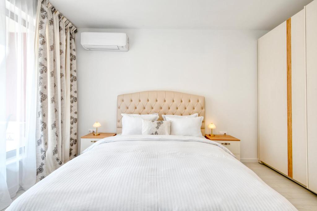 Postel nebo postele na pokoji v ubytování Apartment Grand Karavel Centre