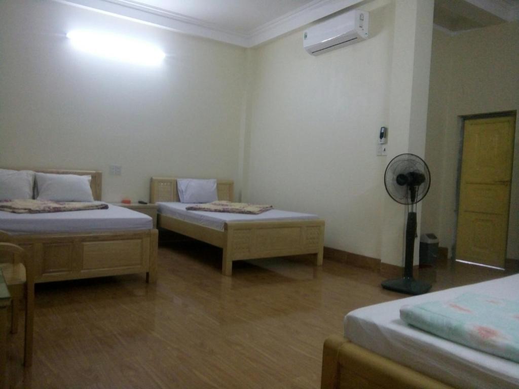 Postel nebo postele na pokoji v ubytování Việt Dũng Motel