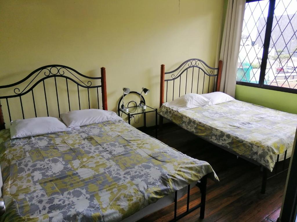 Postel nebo postele na pokoji v ubytování Casa Leon Guesthouse