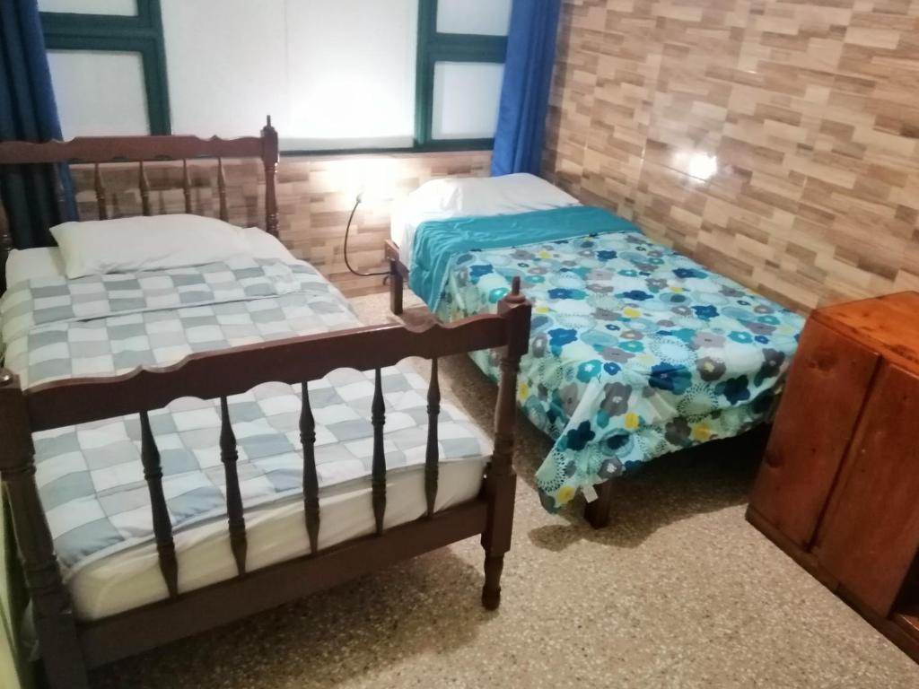 Postel nebo postele na pokoji v ubytování Casa Leon Guesthouse