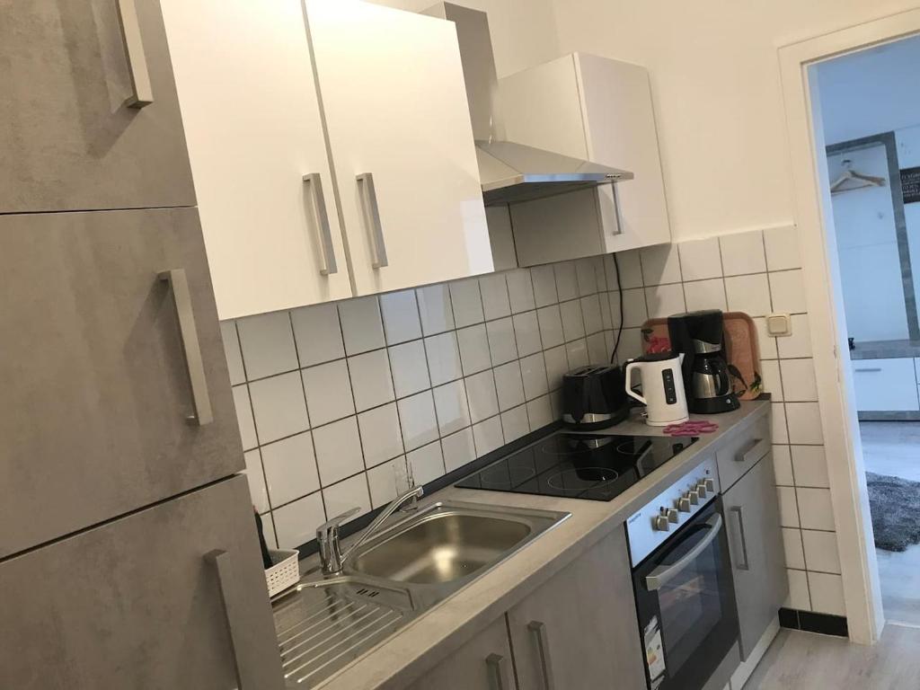 Kuchyň nebo kuchyňský kout v ubytování FeWo Altstadt - Mitten im Herz Goslar