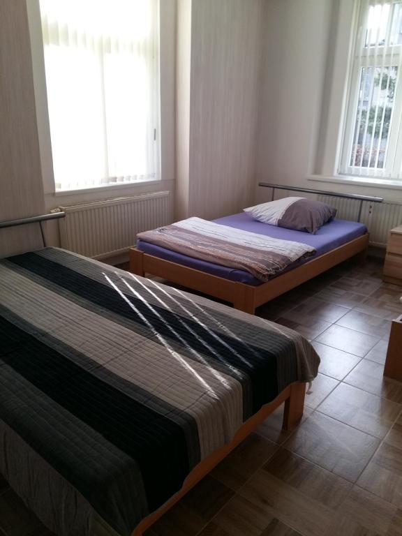 Łóżko lub łóżka w pokoju w obiekcie Penzion Jungmannova