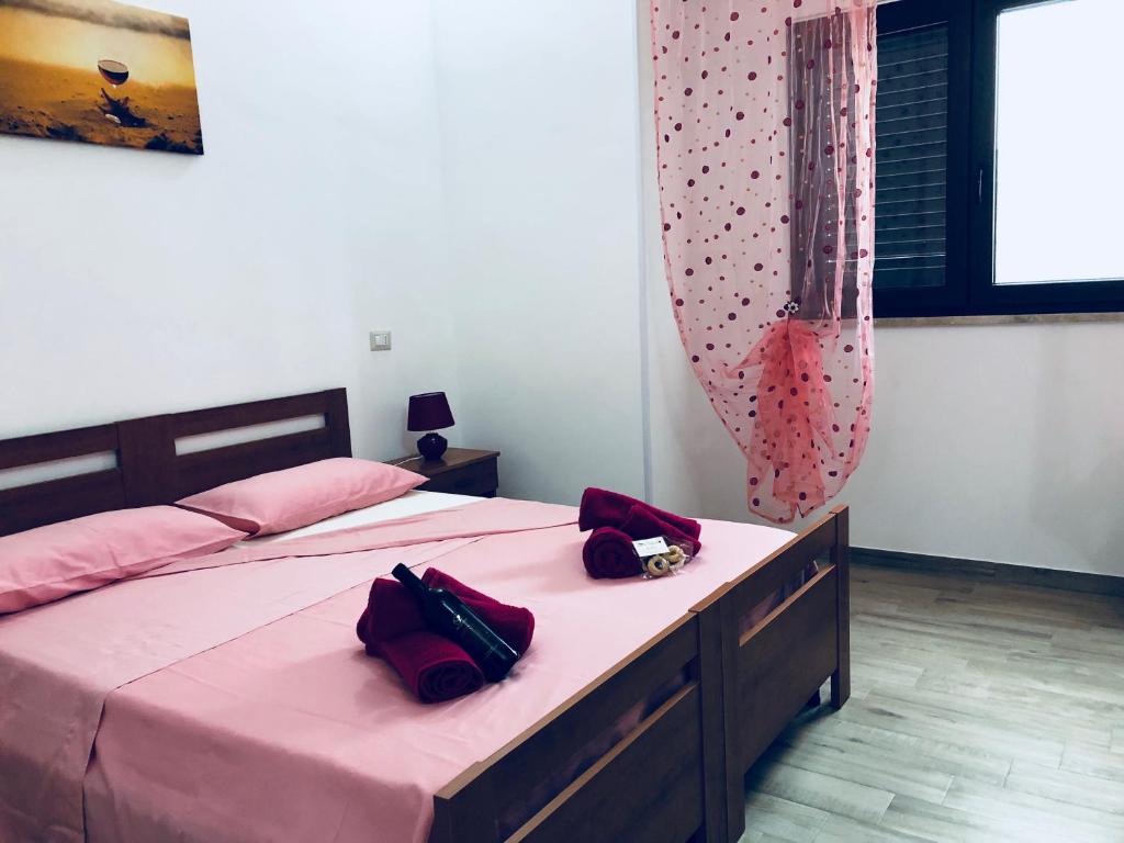 Postel nebo postele na pokoji v ubytování Krasì B&B