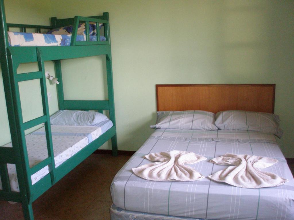 Postel nebo postele na pokoji v ubytování Hostel Iguazu Falls