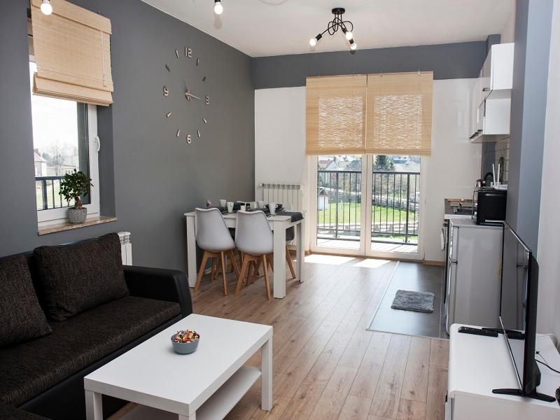 a living room with a couch and a table at Casa de Rosa in Zator