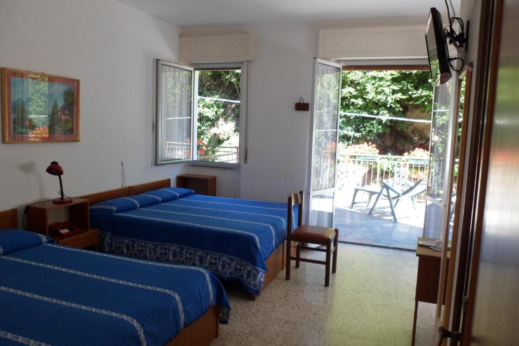 Postel nebo postele na pokoji v ubytování Albergo Ristorante Regina