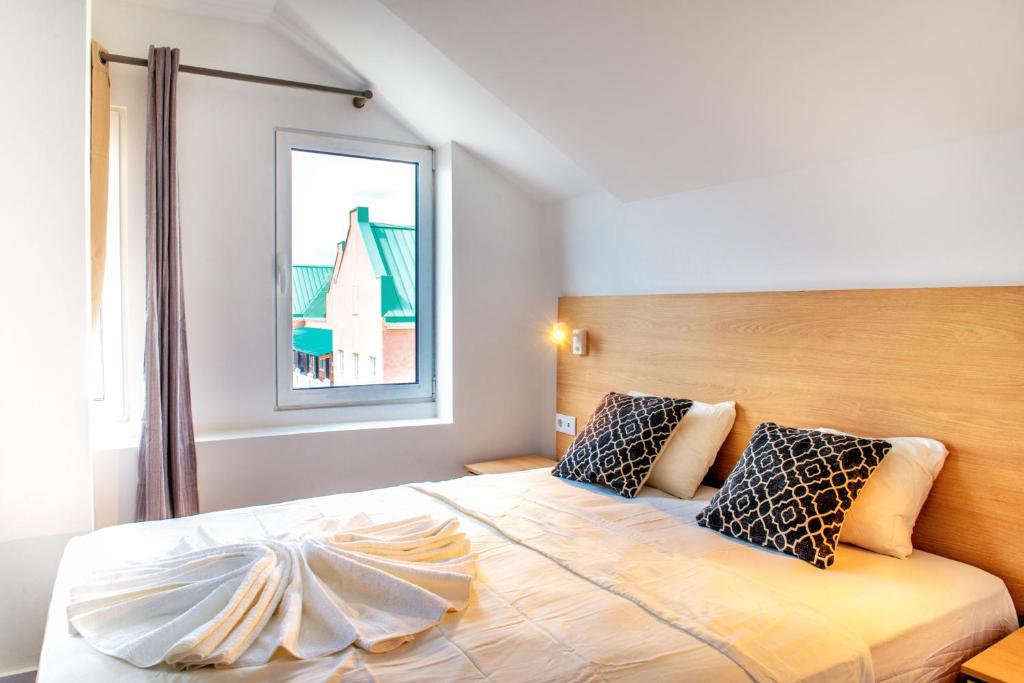 Postel nebo postele na pokoji v ubytování Art Hotel