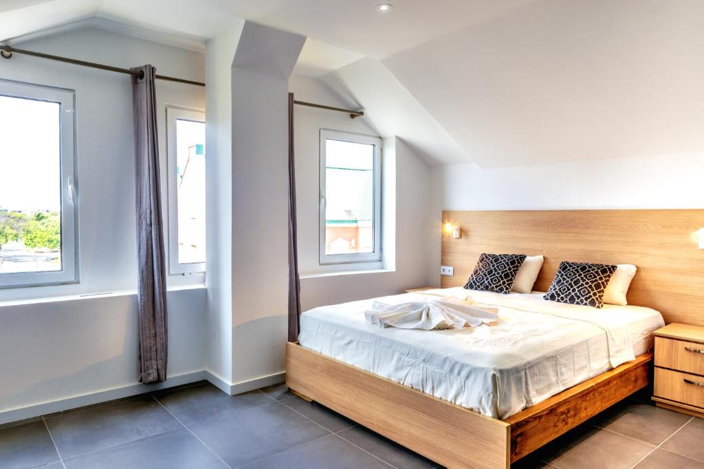 Postel nebo postele na pokoji v ubytování Art Hotel