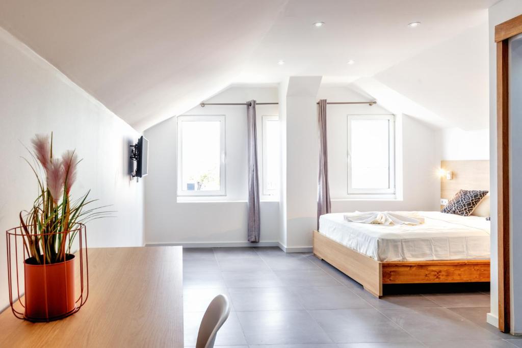 Postel nebo postele na pokoji v ubytování Art Hotel