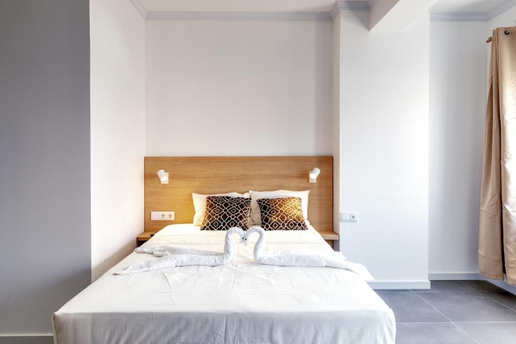 Postel nebo postele na pokoji v ubytování Art Hotel