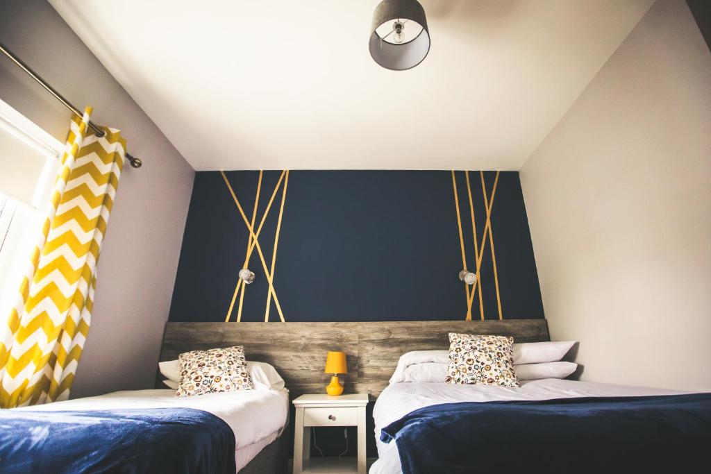 Postel nebo postele na pokoji v ubytování Kerrigan's B&B