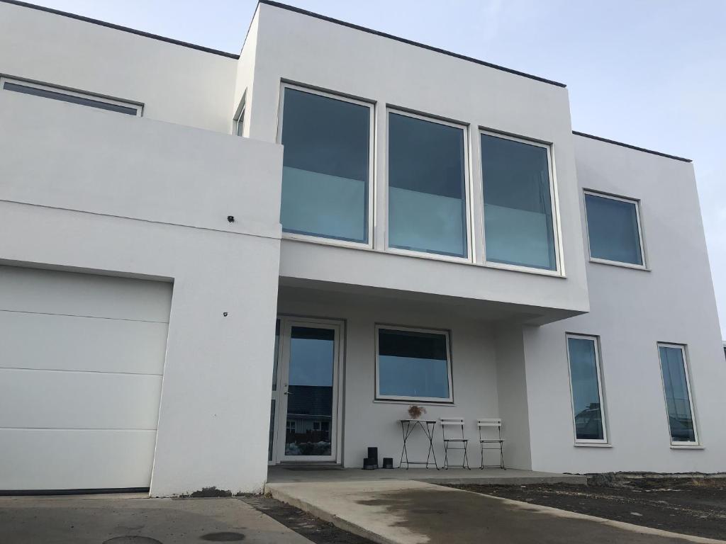 a white building with a lot of windows at Fossagil 2 in Akureyri