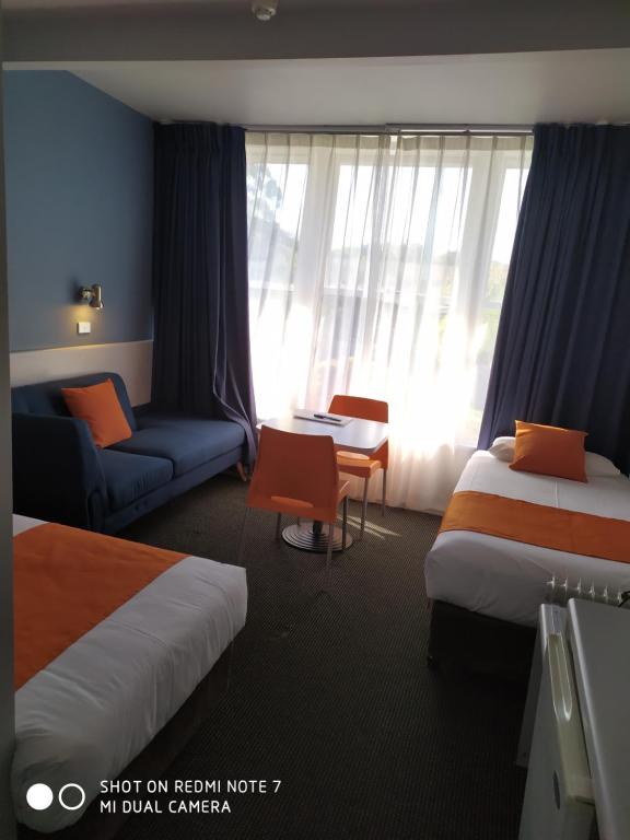 Postel nebo postele na pokoji v ubytování Waterfront Lodge Motel