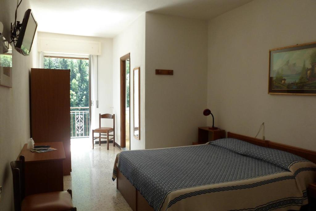 Postel nebo postele na pokoji v ubytování Albergo Ristorante Regina