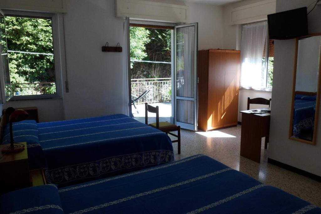 Postel nebo postele na pokoji v ubytování Albergo Ristorante Regina
