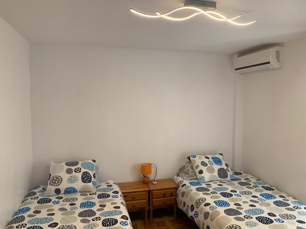Postel nebo postele na pokoji v ubytování Alicante Elegance Suite