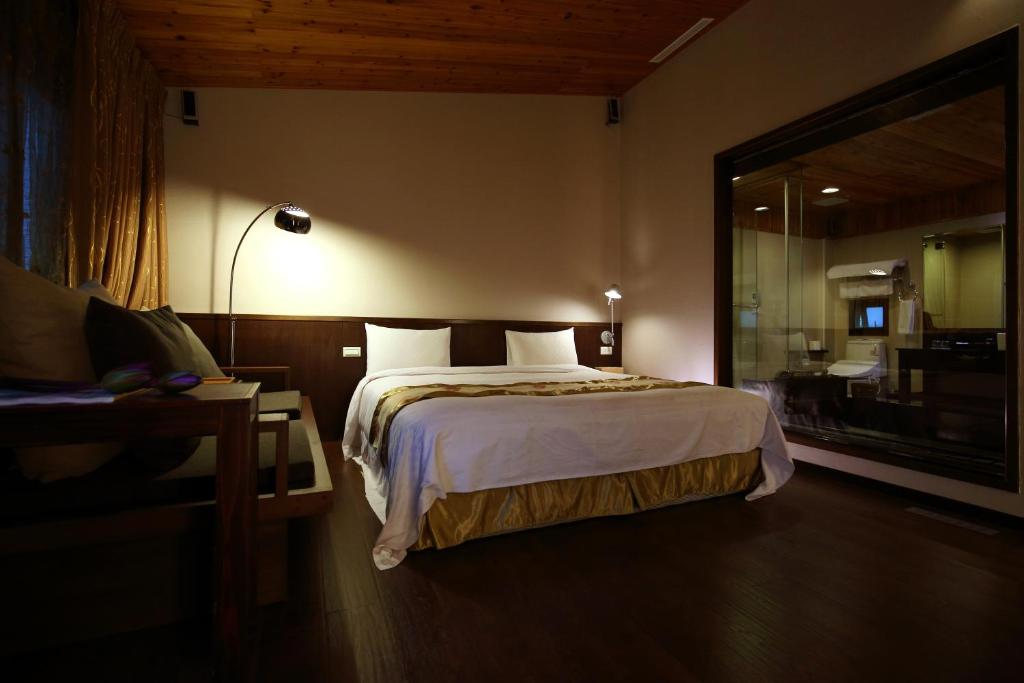 Postel nebo postele na pokoji v ubytování Grace Garden Villa