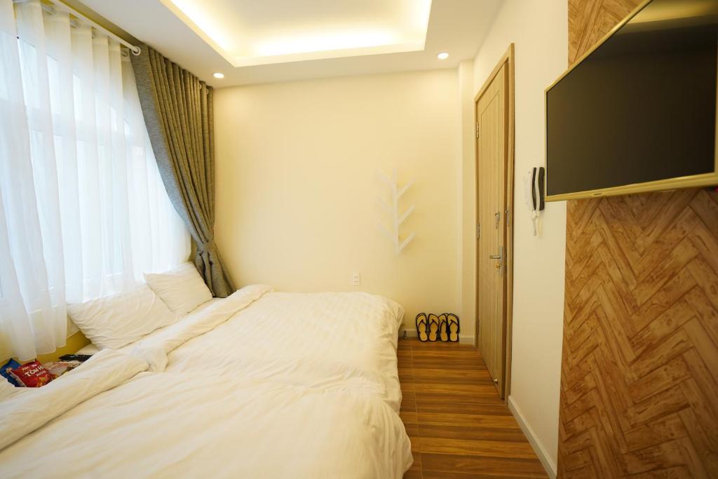 TV a/nebo společenská místnost v ubytování Homeland Hotel