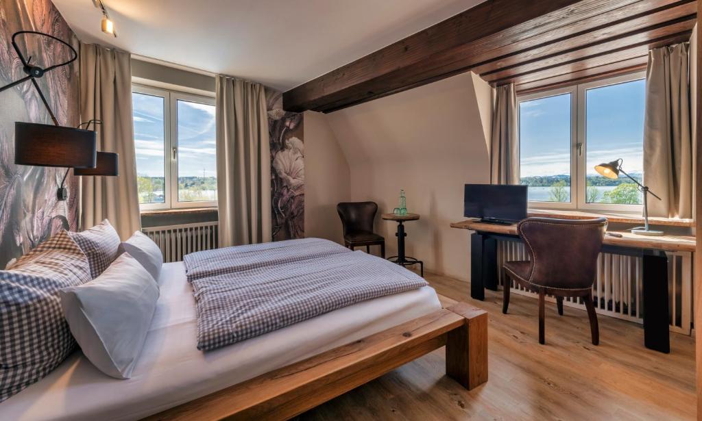 Postel nebo postele na pokoji v ubytování Hotel Starnberger See