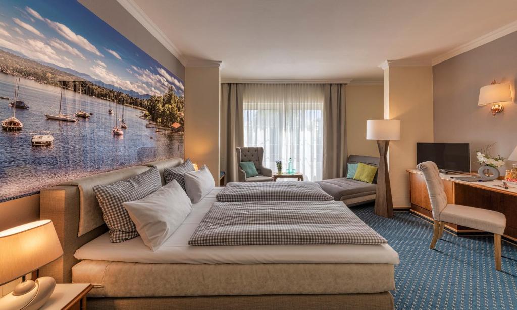 Postel nebo postele na pokoji v ubytování Hotel Starnberger See