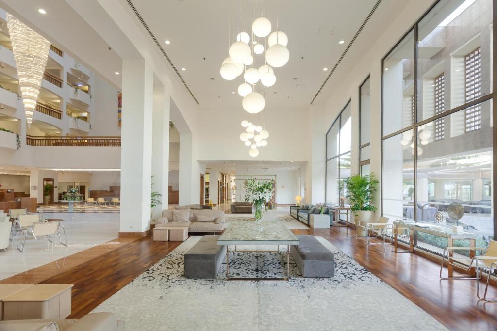 a lobby with a couch and a table at St Raphael Resort in Limassol