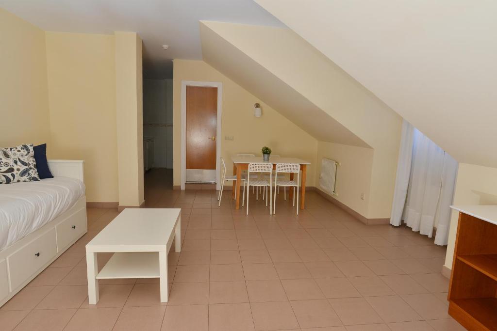 A bed or beds in a room at Apartamentos Marina