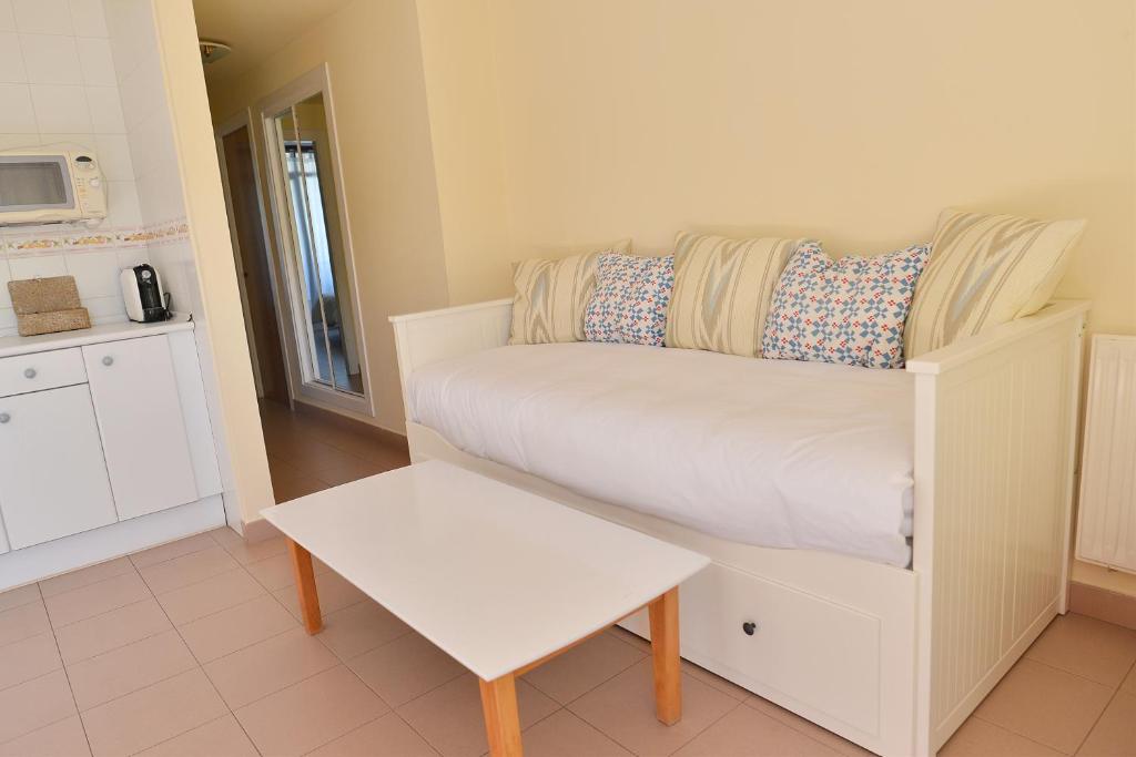 A bed or beds in a room at Apartamentos Marina