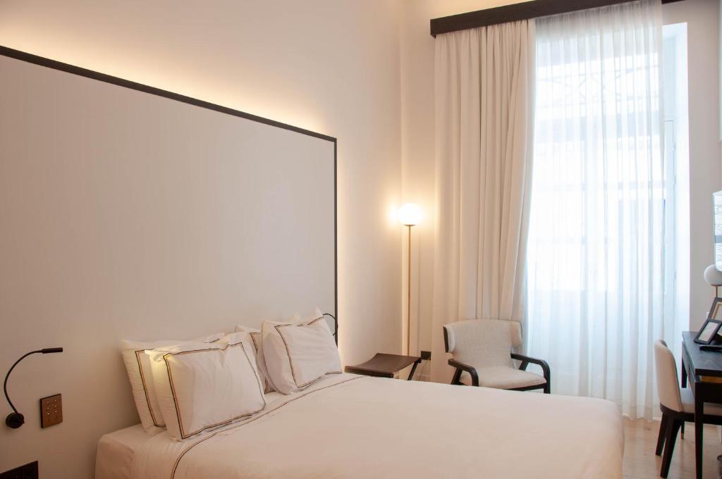 Postel nebo postele na pokoji v ubytování S Paul City Hotel