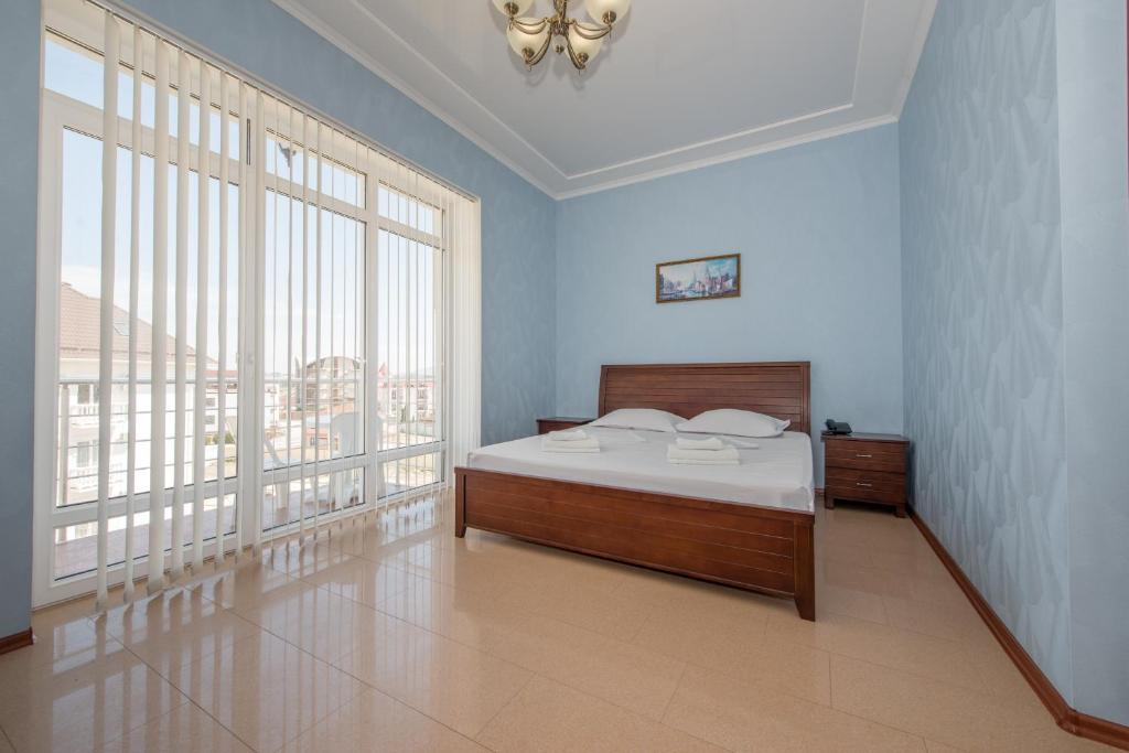 Cama o camas de una habitación en Гостевой дом Парадиз Resort