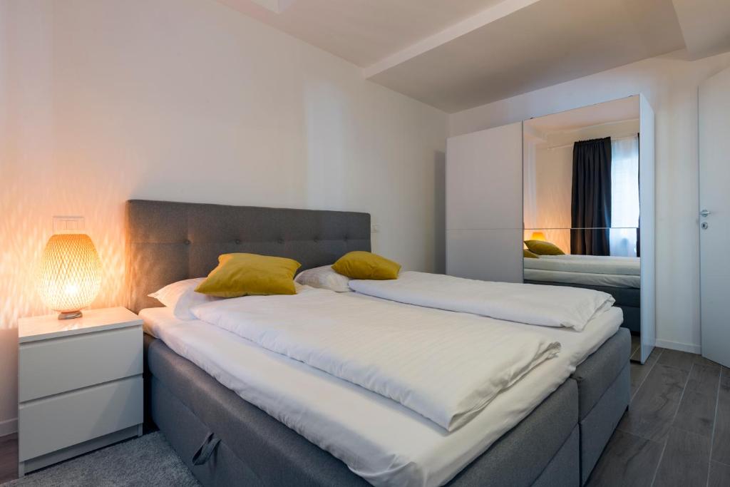 Posteľ alebo postele v izbe v ubytovaní Albergo Diffuso ELA Living - Design Apartment & Room