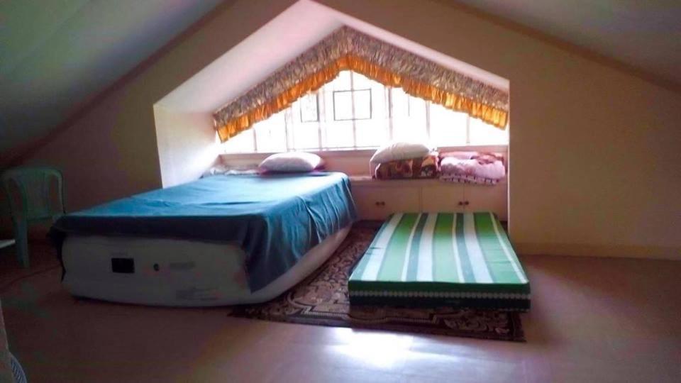 Postel nebo postele na pokoji v ubytování Tagaytay Budget Transient/ Staycation Home